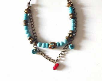 Turquoise and coral bronze beaded necklace with Tibetan bead