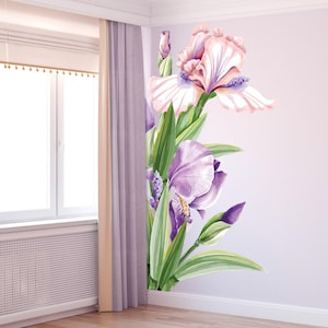 May include: Watercolor wall decal of iris flowers in shades of purple, pink, and green. The floral design features large blooms, buds, and leaves, creating a botanical accent for interior decor.