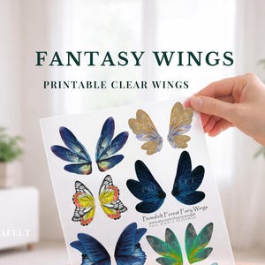 May include: A sheet of printable fantasy wings in various designs and colors, including blue, gold, and green. The text "FANTASY WINGS PRINTABLE CLEAR WINGS" is displayed at the top. The sheet is held by a hand.