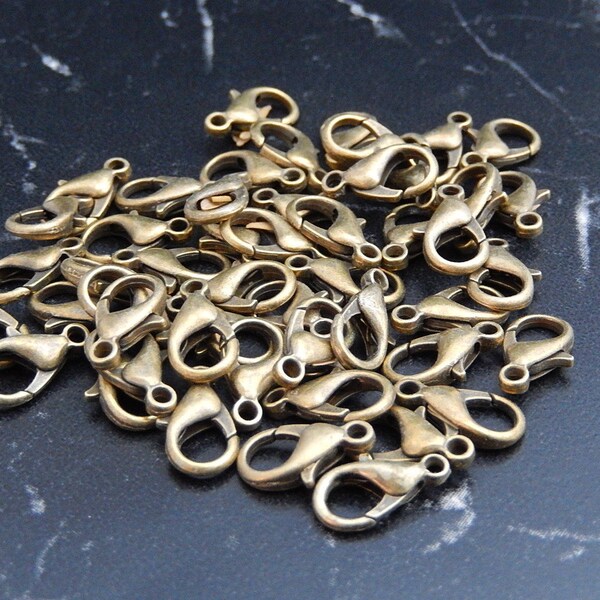 10 fermoirs mousquetons en bronze antique 8x14mm