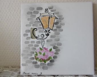 Hand painted Tile for a door or a gate decorated with a lantern