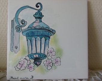 Hand painted Tile for a door or a gate decorated with a lantern