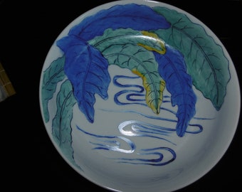 Hand-painted porcelain bowl decorated with a Japanese-inspired pattern