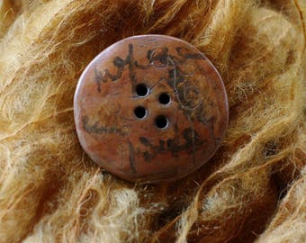 1 beautiful shades of red ochre and grey button