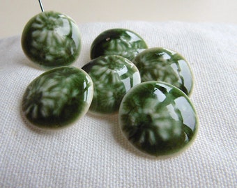 Beautiful green porcelain buttons sewing and knitting accessories, ceramic crafts.