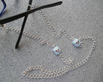 Necklace close to glasses and its pretty cool Fimo charms