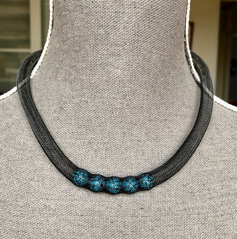 Black fishnet necklace with 5 turquoise and black beads
