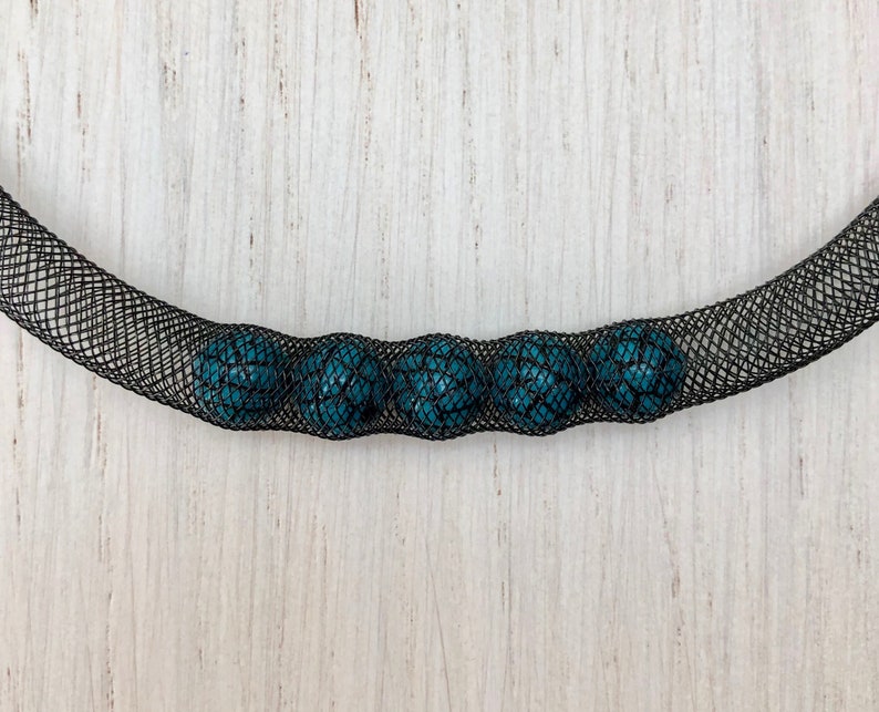 Black fishnet necklace with 5 turquoise and black beads