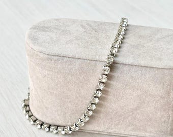 Silver stainless steel bracelet adjustable by sliding link with oval connector in platinum-plated brass paved with zircons for women