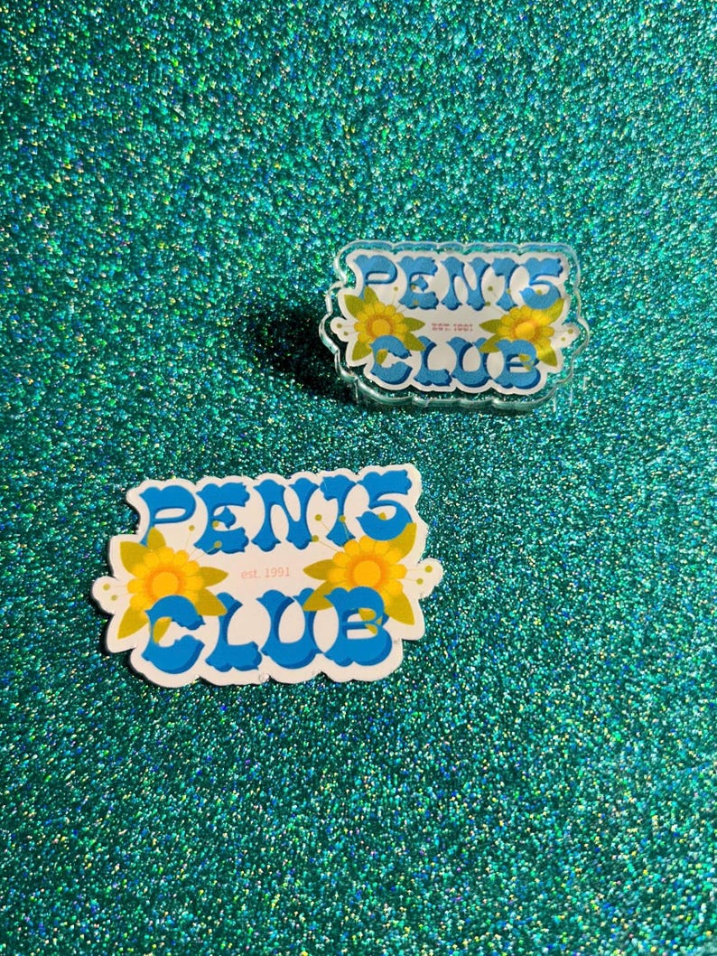 May include: Two blue and white stickers with the text "PENIS CLUB est. 1991" in a retro font. The stickers are decorated with yellow sunflowers.