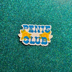 May include: A blue and white sticker with the text "PENTS CLUB est. 1991" in a retro font. The sticker is decorated with two yellow flowers.