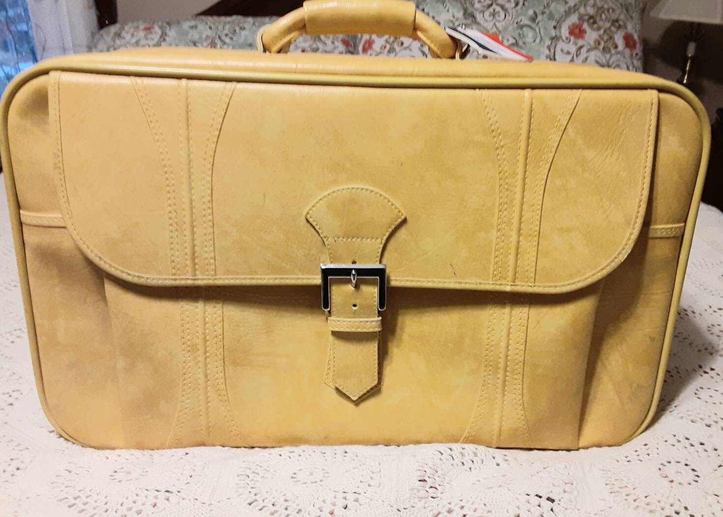 vintage american tourister luggage yellow