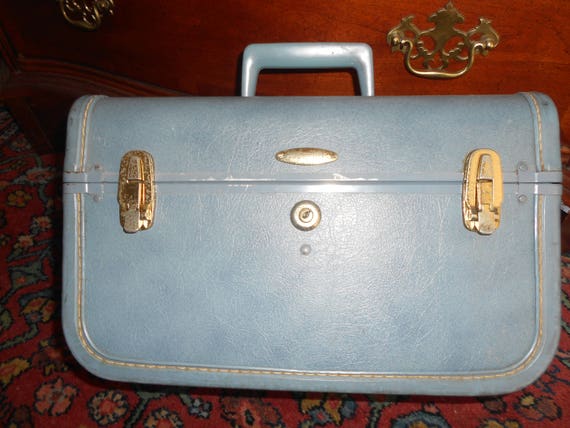 taperlite vintage luggage