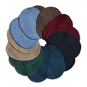 May include: A selection of knitted beanies in shades of blue, brown, green, and navy. The beanies are displayed in a circular arrangement, highlighting their diverse colours and textures. The hats are made from a soft, knitted fabric.
