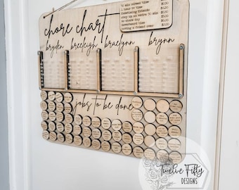 May include: A wooden chore chart with four columns labeled "Bryden", "Breckigh", "Braclynn", and "Brynn". Each column has a grid with spaces for magnetic tokens. Below the columns is a row of wooden tokens with various chores written on them. The chart is labeled "Chore Chart" and has a list of chores and their corresponding prices.
