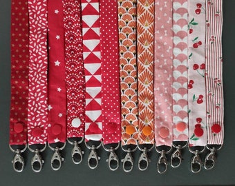 Portachiavi o porta badge - tonalità rosso/corallo