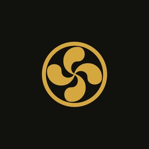 May include: A gold-colored four-leaf clover design inside a circle, on a black background.