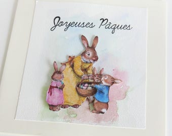 Tarjeta de Pascua en 3D con conejos y búsqueda de huevos.