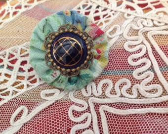 Victory, textile and porcelain ring