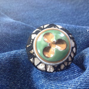 Celadon button ring, porcelain, fabrics