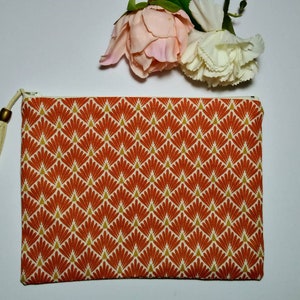 Make-up pouch in Japanese red and yellow shell fabric.