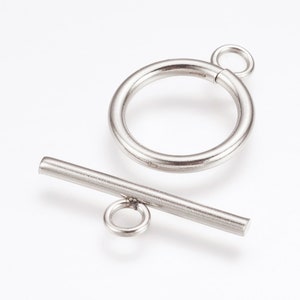 May include: Silver-toned metal toggle clasp with a round ring and a straight bar. The clasp is used for jewelry making.