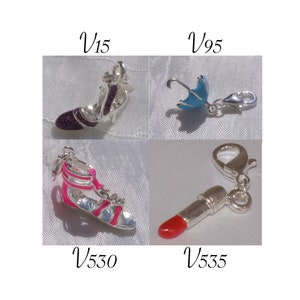 Silver charm, purple shoe, blue umbrella, silver carabiner, blue umbrella, pink spartan, lipstick, V15,V95,V530,V535