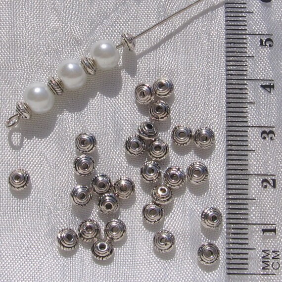 LOT DE 50 PERLES INTERCALAIRES TOUPIES 5MM x 3MM ARGENTE TROU 1,5MM BIJOUX S1