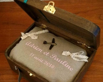 personalized wedding ring holder for a travel-themed wedding: the wooden suitcase