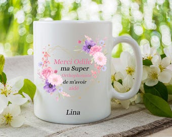May include: White ceramic mug with a floral design and the text "Merci Odile, ma Super Orthophoniste de m'avoir aide Lina".