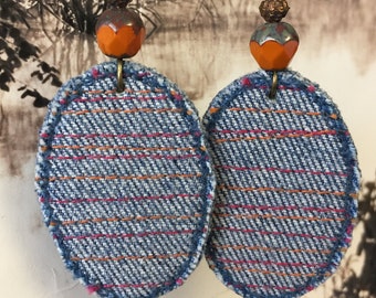 Earrings in orange stitched jeans