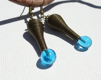 Buckles with spiral shape pendants and turquoise glass drop