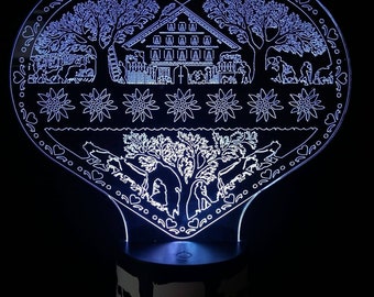 Led lamp in plexiglass, in the shape of a heart with a Swiss poya motif (mounted on the mountain pasture). Comes with remote control to vary the colors.