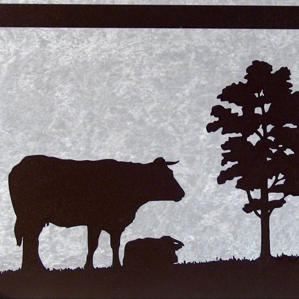Une vache et un arbre, tableau silhouette en bois découpé