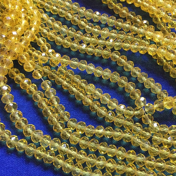 1 fil de perles/enfilade de perles,99 perles,6/4mm,perles jaune d'or,bouton d'or,transparentes,perles donuts,perles cristal de verre