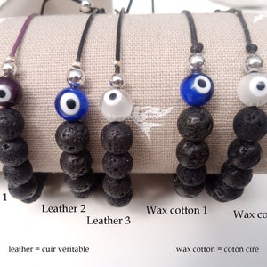 May include: Five bracelets featuring black porous lava stone beads, a silver-toned spacer, and a single glass evil eye bead. The bracelets are labeled Leather 1, Leather 2, Leather 3, Wax cotton 1, and Wax cotton 2, with text indicating leather and wax cotton.