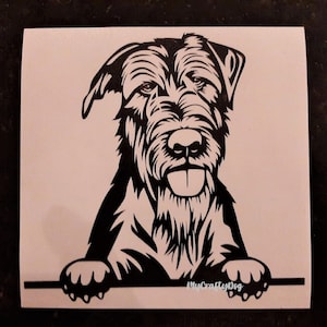 May include: Black and white silhouette of a Wirehaired Pointing Griffon dog peeking over a surface with the text "MyCraftyDog" in white.