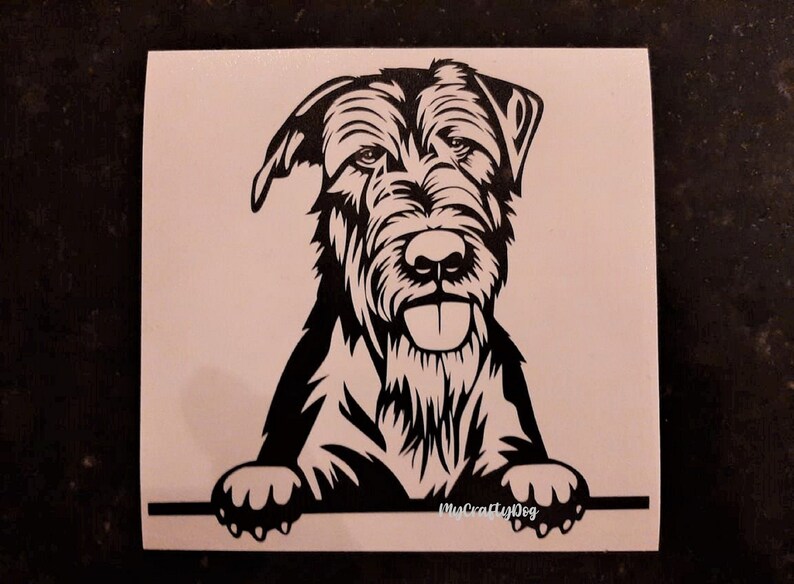 May include: Black and white silhouette of a Wirehaired Pointing Griffon dog peeking over a surface with the text "MyCraftyDog" in white.