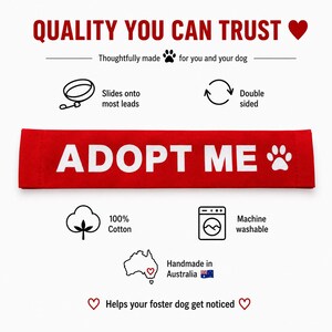 May include: A rectangular red fabric leash sleeve featuring the white text ADOPT ME and a paw print icon. The graphic includes icons for 100% cotton material, machine washability, double-sided design, and compatibility with most dog leads.