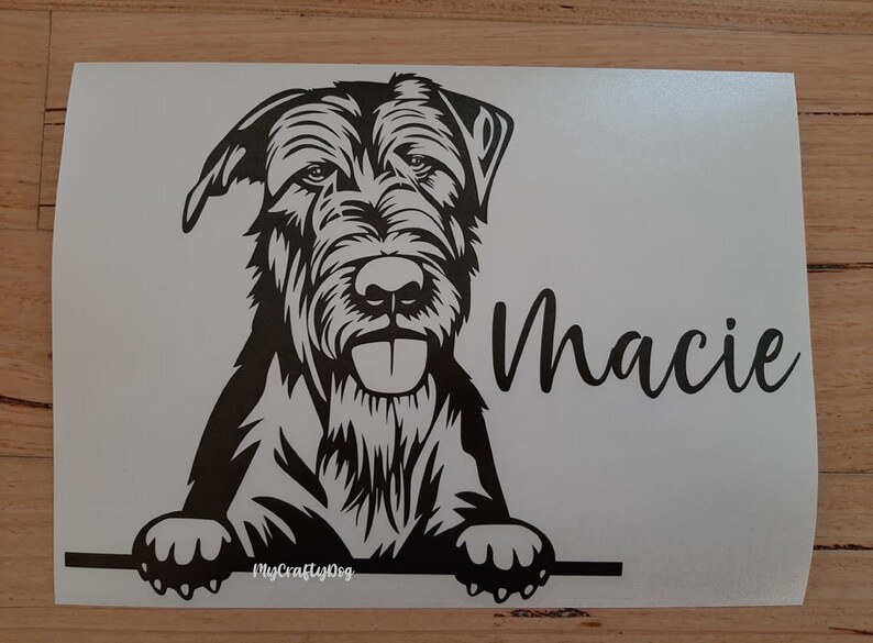 May include: Black and white silhouette of a dog's head and paws peeking over a surface. The dog's name, "Macie", is written in cursive below the image. The text "MyCraftyDog" is in the bottom left corner.