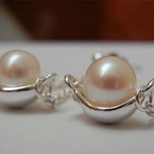 White Freshwater Pearl Earrings Hanging on a Chain
