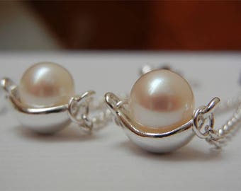 White Freshwater Pearl Earrings Hanging on a Chain