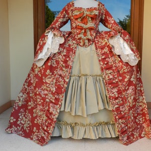 Large 18th century French dress in floral burgundy fabric and almond green taffeta for historical costume.