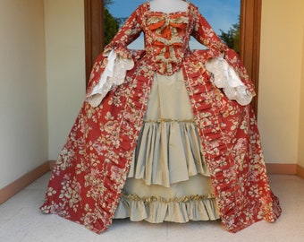Large 18th century French dress in floral burgundy fabric and almond green taffeta for historical costume.