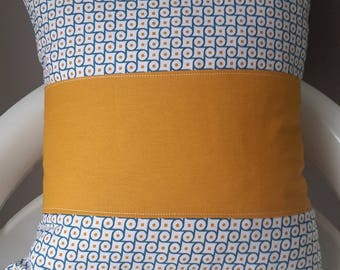 Cushion cover with blue and mustard yellow graphic patterns