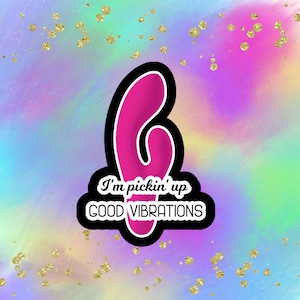 May include: Pink and black sticker with a pink heart-shaped object and the text "I'm pickin' up GOOD VIBRATIONS".