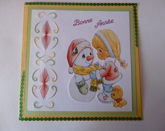 2022093 carte brodée " fillette et son bonhomme de neige "