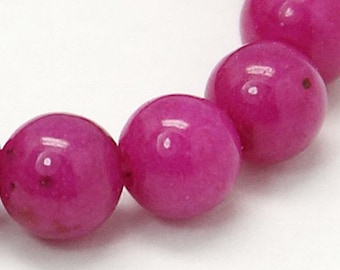 Perle jade mashan naturelle,ronde,teint fushia foncé ,10 mm,vendu par 10