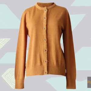 Cardigan baby alpaca, vest baby alpaca with button closure and crew neck color ginger orange .