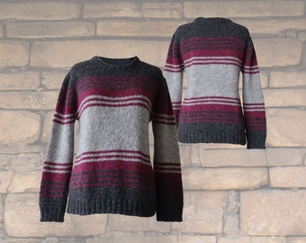 Women's sweater made from an alpaca blend yarn, with a soft brushed texture and a stripe design featuring three different colors.